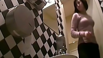 Busty Brunette White Woman In The Ladies Room Pisses