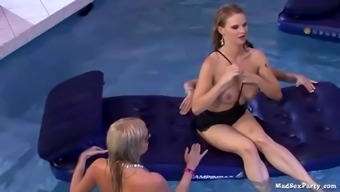 A Group Of Lesbians Eat Their Pussies Out In The Pool