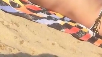 Topless Milf Reading Newspaper On The Beach