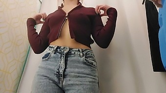 Young Girl In The Fitting Room Of The Store