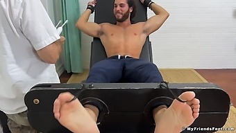 Handsome Man Enjoys While His Kinky Friend Tickles His Feet