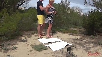 Blonde Gets A Big Cock Handjob In The Sand